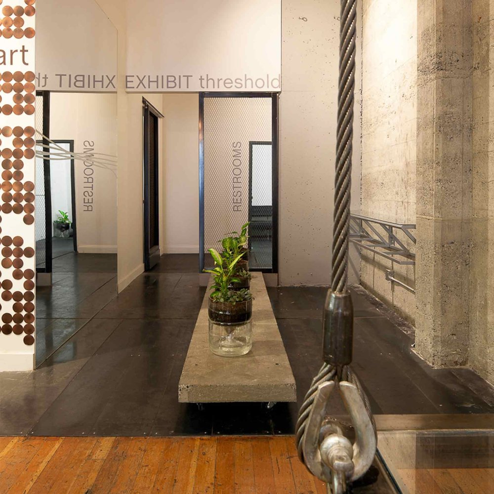 Espresso Lounge — Concrete display ledge beside an exposed column