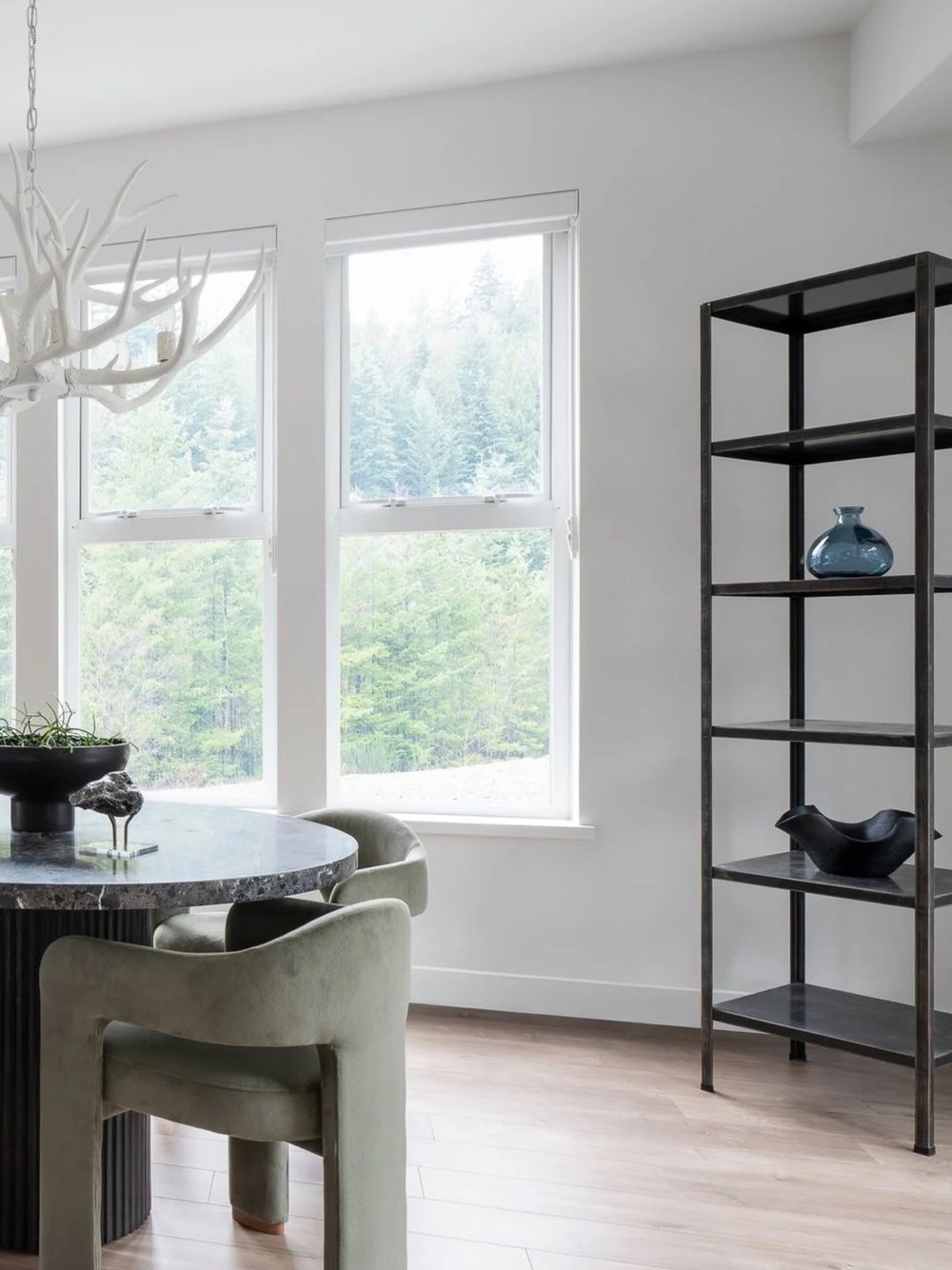 Britannia Beach House — Tall windows, green dining chair and open black shelving